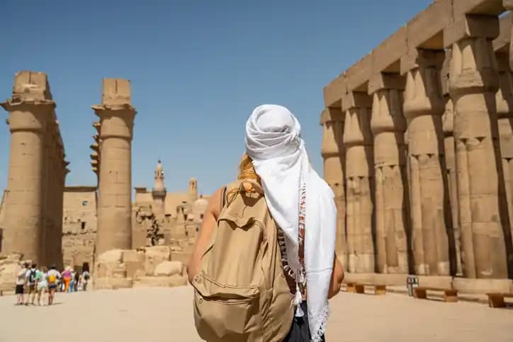 Female Tourist Enjoying Ancient Attractions in Luxor Female Tourist Enjoying Ancient Attractions in Luxor
